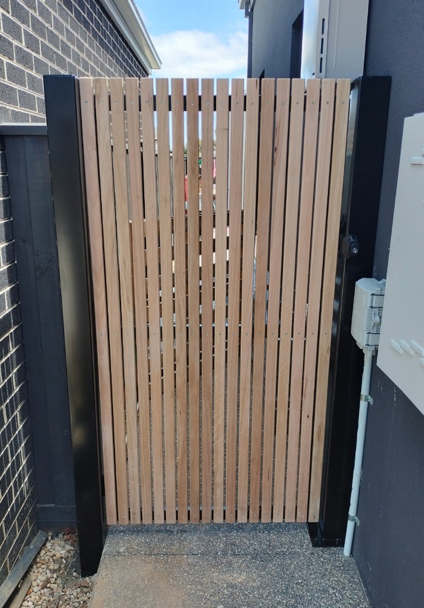 Custom hardwood batten pedestrian gate with black steel posts