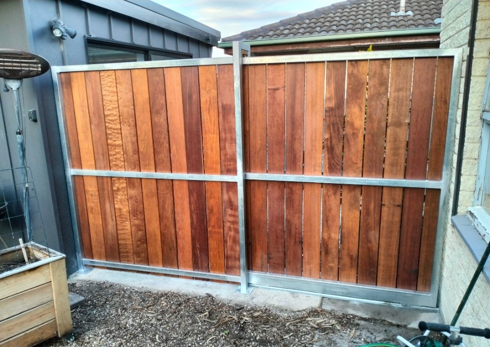 Merbau clad slider gate looking from the inside of the property
