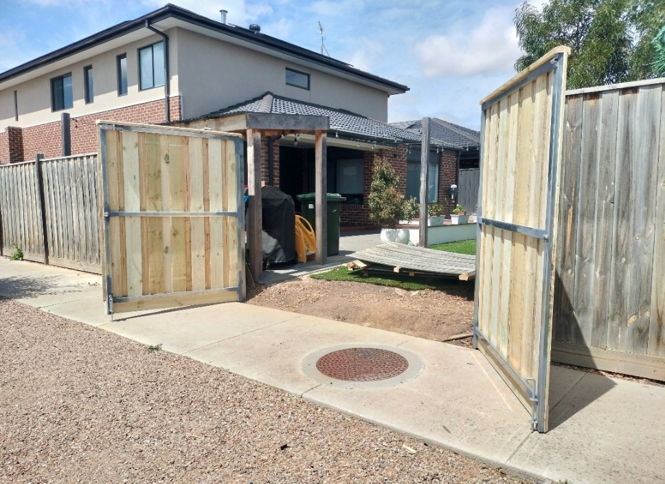 Hidden pine gates retro-fitted into existing pine fence