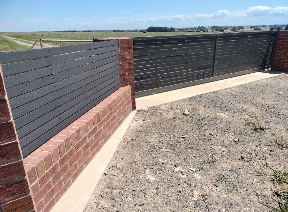 Rural solar operated slider gate with brick detail